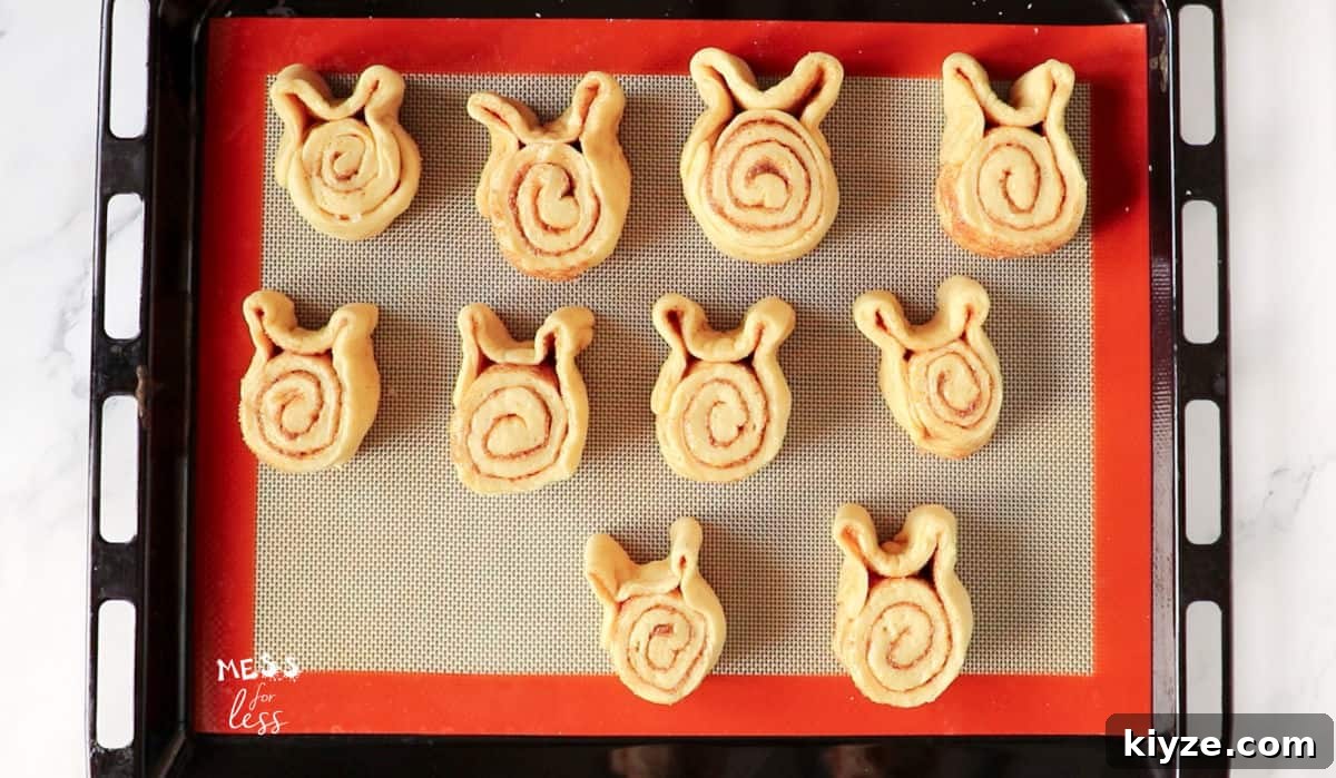 Bunny-Shaped Cinnamon Rolls: Cute Recipe for Spring Brunch 12 cinnamon roll bunnies on silpat