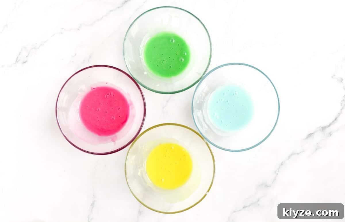Bunny-Shaped Cinnamon Rolls: Cute Recipe for Spring Brunch 15 colors of icing in a bowl