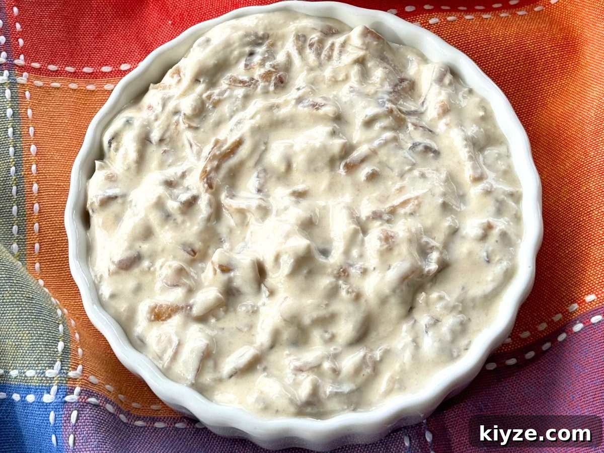 Bowl of caramelized onion dip with Greek yogurt.