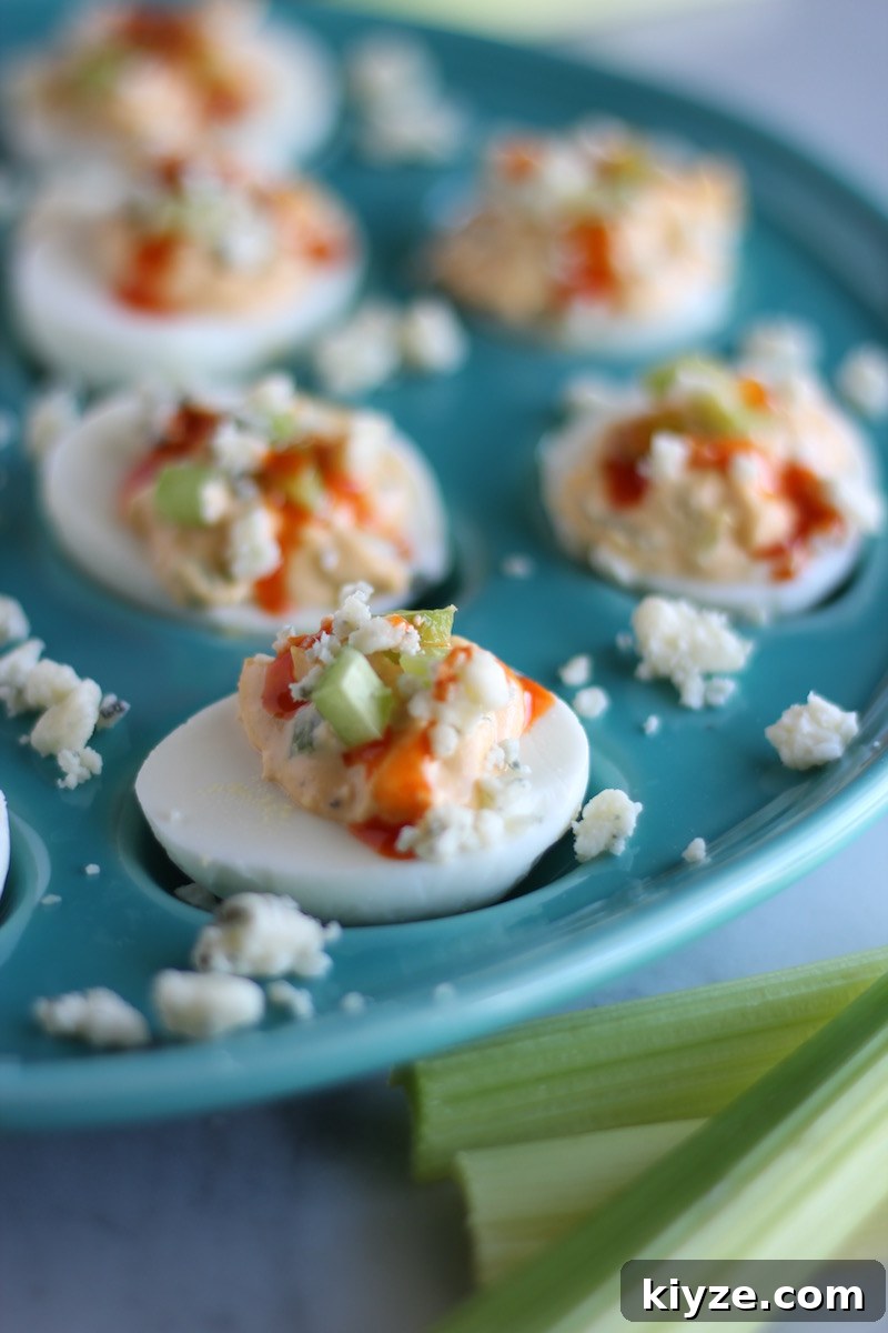 Buffalo Deviled Eggs - buffalo wings + deviled eggs = a delicious combination! | fedandfulfilled.com