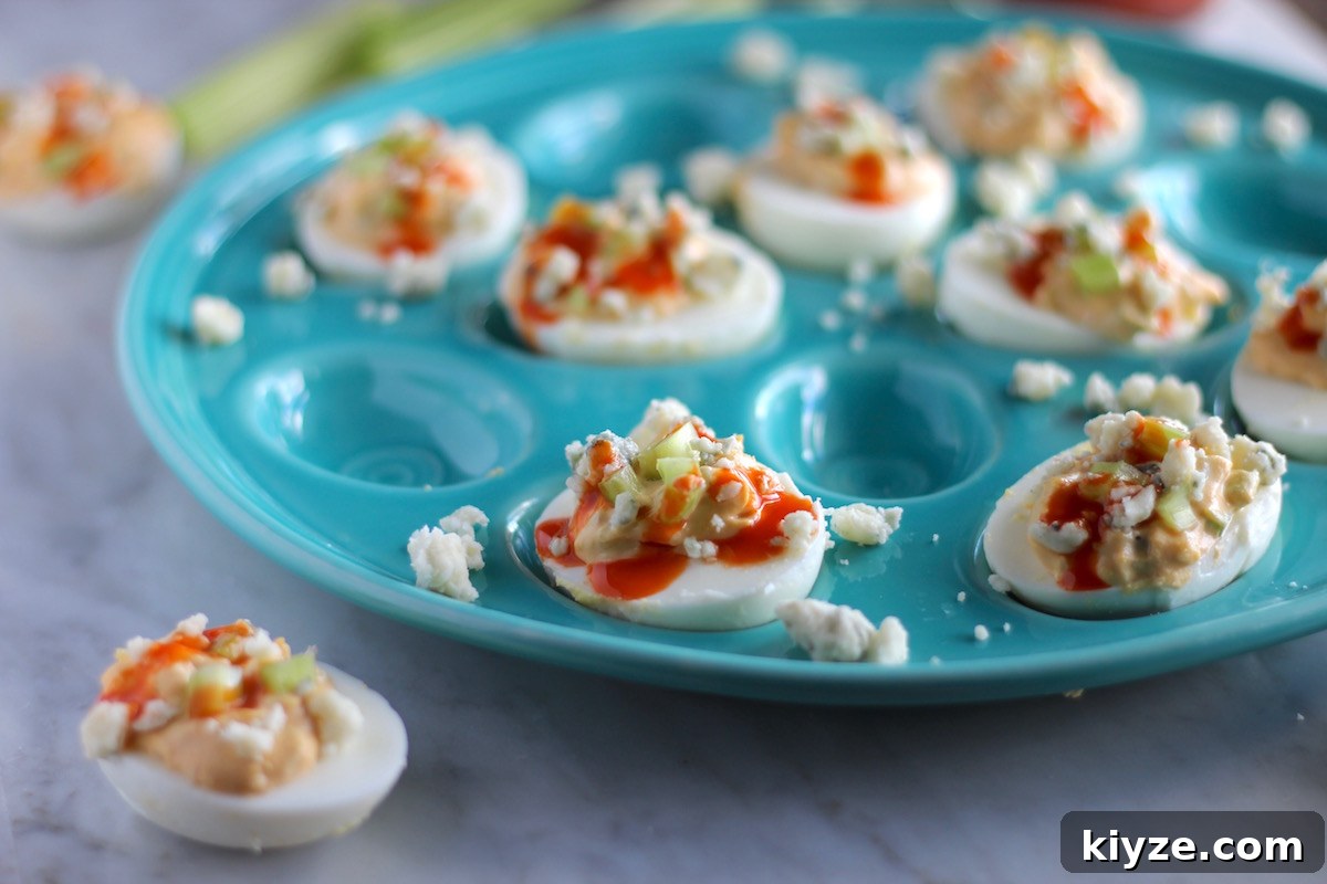 Buffalo Deviled Eggs - a 5-ingredient paleo-friendly recipe that is an easy and super flavorful appetizer that your friends will love! | fedandfulfilled.com