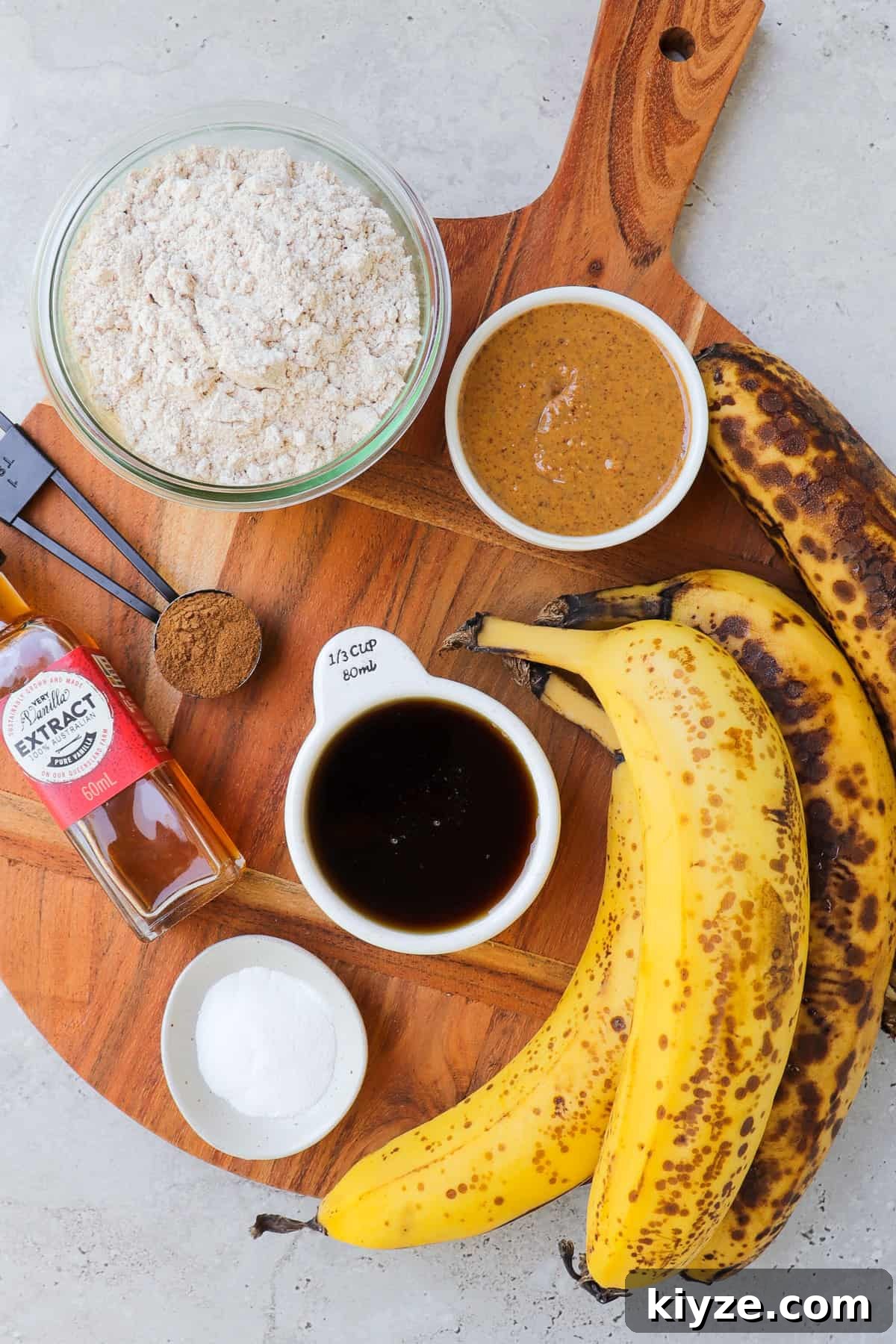 5-Ingredient Vegan Banana Bread Recipe 4 Ingredients on wooden board to make vegan banana bread.