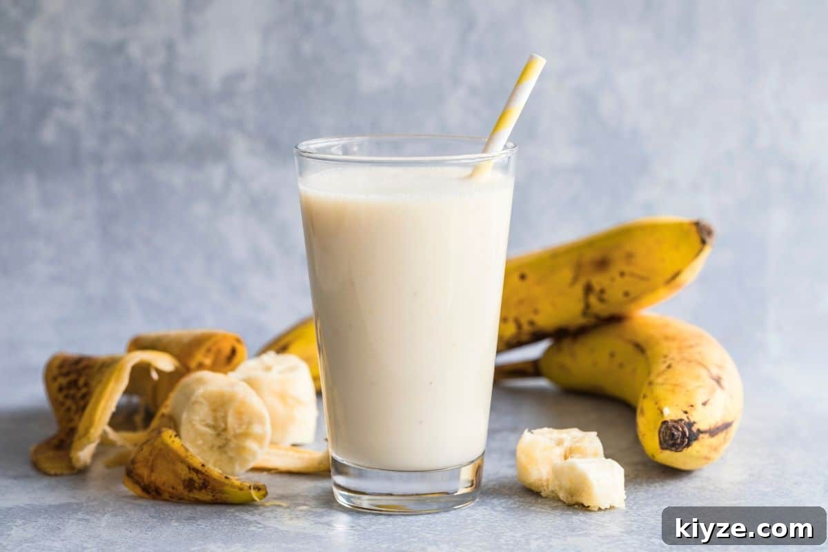 Quick 5-Minute Banana Puree Recipe for Babies 10 banana smoothie with banana peels around it