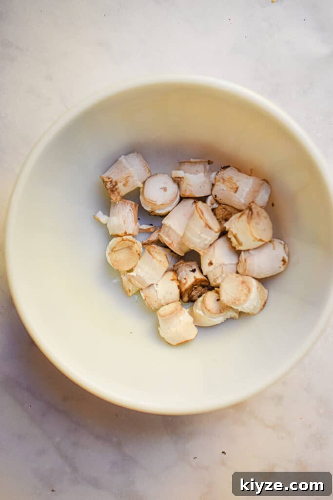The stems of the mushrooms are in abowl