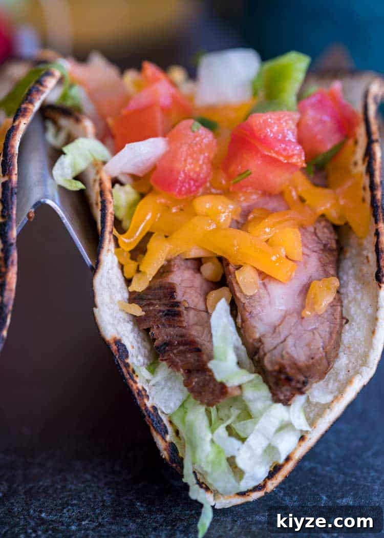 Cilantro-Lime Flank Steak Tacos with Charred Onions 4 close up of a Flank Steak Taco