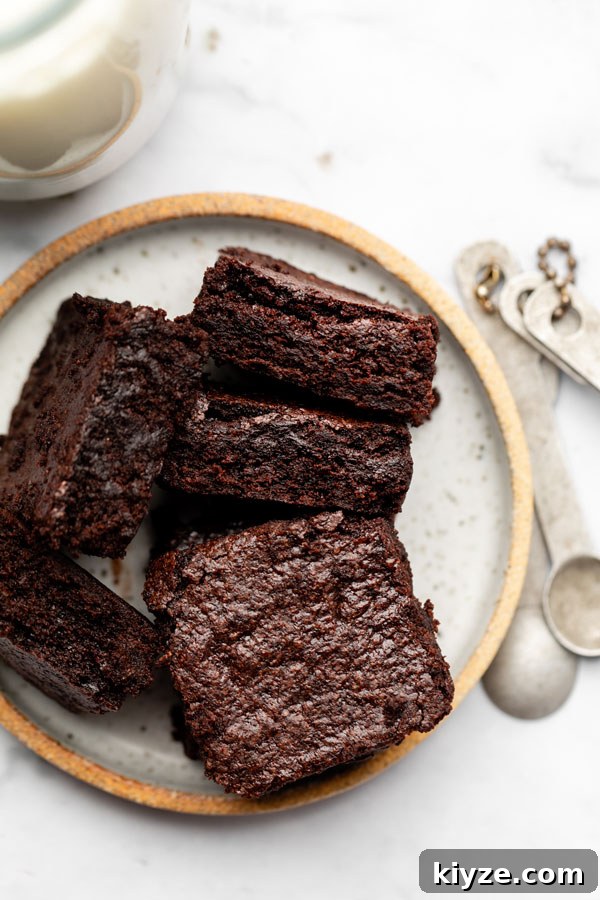 One-Bowl Fudgy Gluten-Free Brownies Recipe 2 overhead shot of sliced fudgy gluten free brownies on a white plate