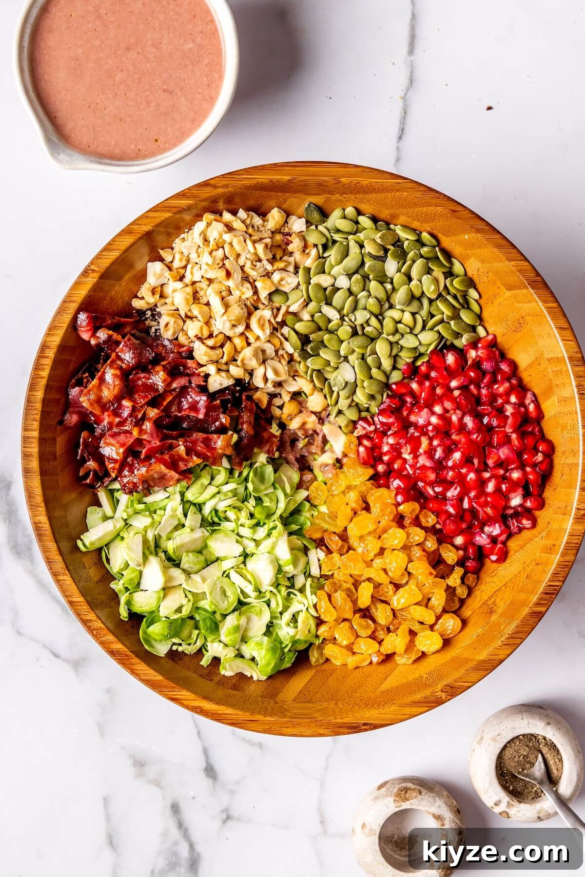 Shaved Brussels Sprout Salad with Roasted Shallot & Pomegranate Vinaigrette 11 How to Make Shaved Brussels Sprout Salad Step 6 - Olivia Adriance