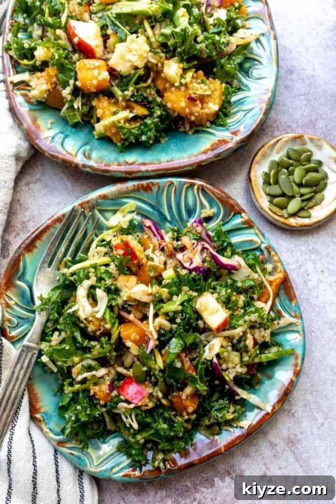 Autumn Harvest Salad with Roasted Squash, Apples & Maple Vinaigrette 4 Kale Harvest Salad on blue plates with forks.