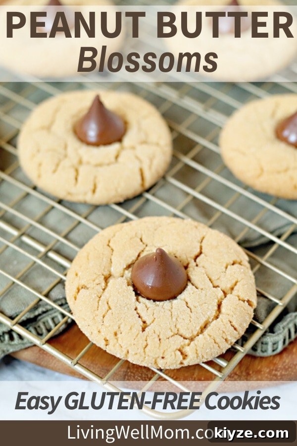 Gluten-Free Peanut Butter Blossom Cookies — Video Recipe & Tips 2 gluten-free peanut butter blossoms with hershey's kisses cooling on wire rack