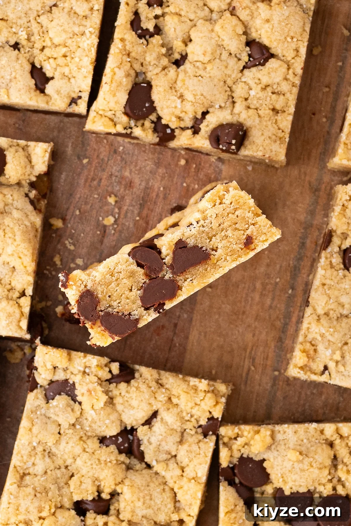 Bourbon Chocolate Chip Cookie Bars Recipe — Rich Boozy Dessert 13 Closeup showing the dense, blondie-like center texture of the bars.