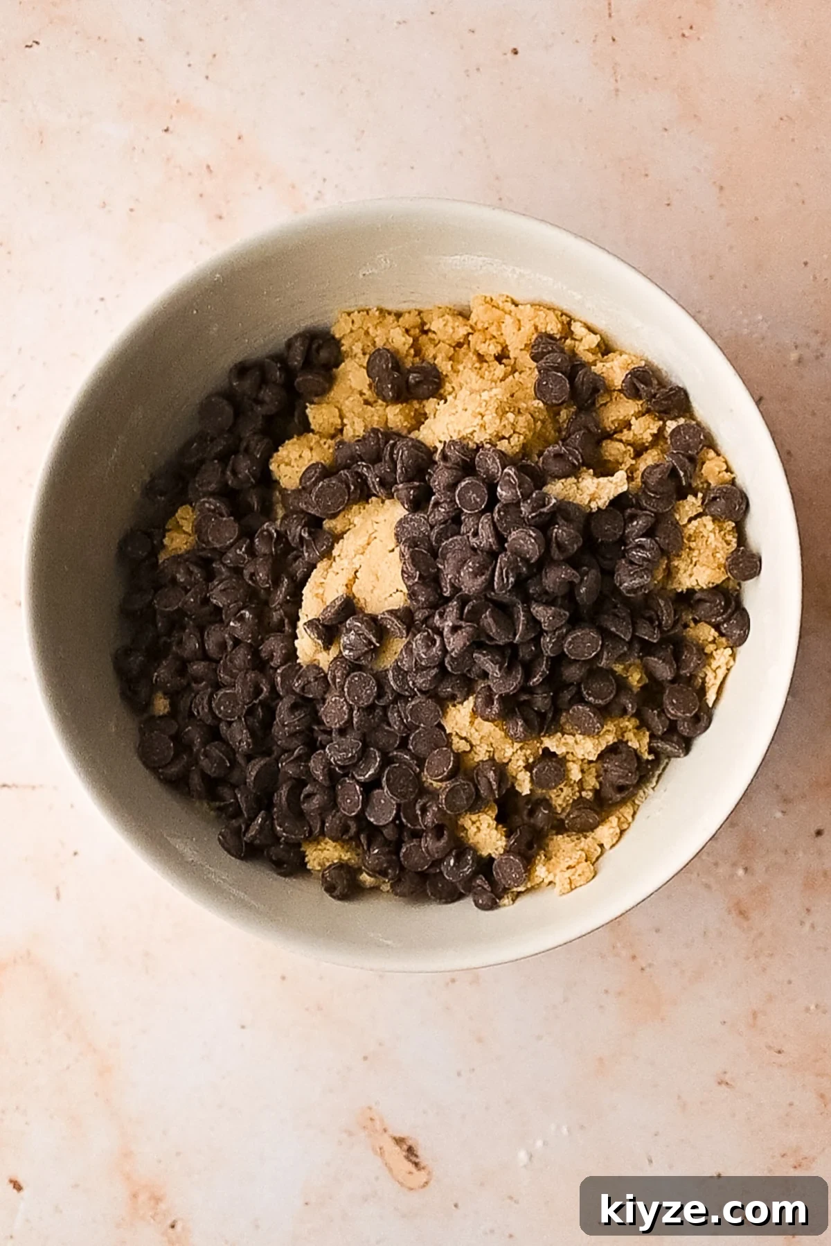 Bourbon Chocolate Chip Cookie Bars Recipe — Rich Boozy Dessert 7 Folding in lots of chocolate chips to the batter.