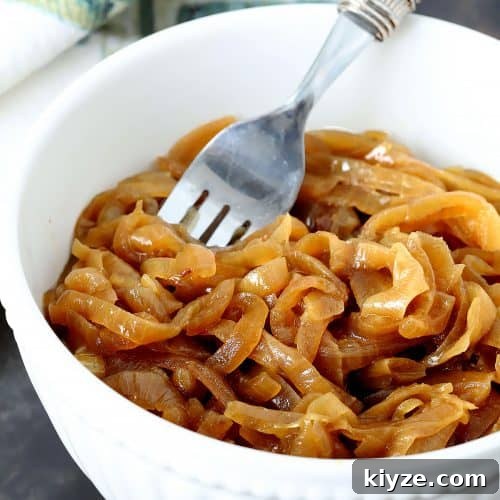 Instant Pot Caramelized Onions: Quick, Deeply Sweet Results 10 Onions in a white bowl that have been caramelized in the Instant Pot.