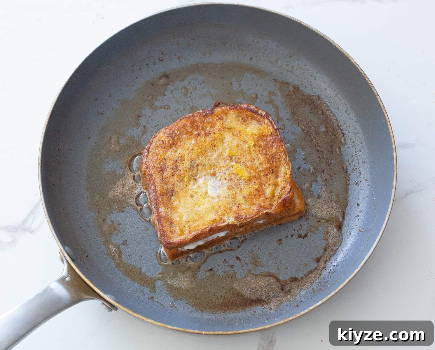 Banana-Stuffed French Toast with Cinnamon Maple Glaze 8 bread in a pan