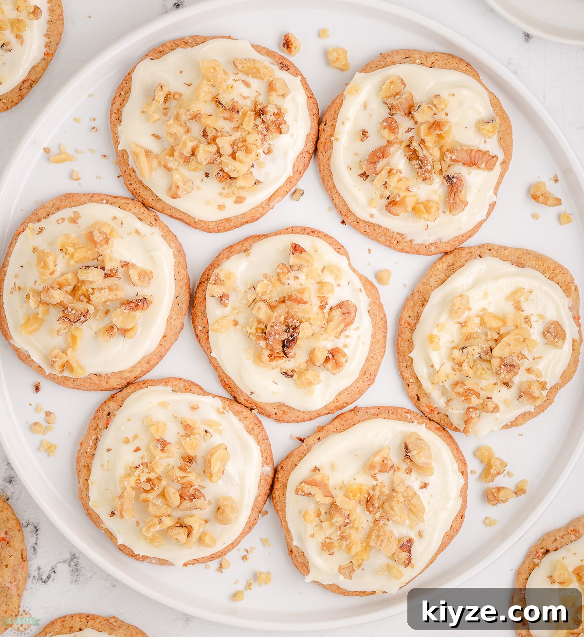 Carrot Cake Cookies with Cream Cheese Frosting Recipe 4 plate of Carrot Cake Cookies topped with cream cheese frosting and walnuts
