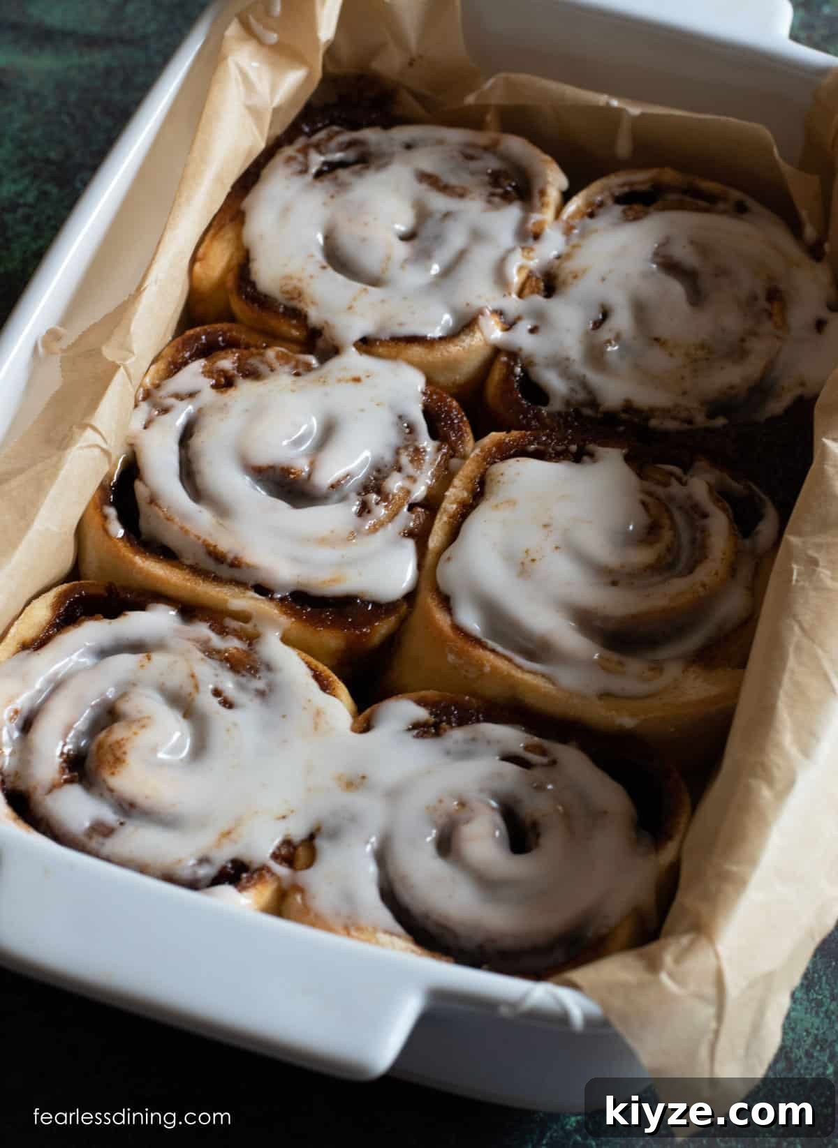 Gluten-Free Gingerbread Cinnamon Rolls Recipe 9 Baked gluten free gingerbread cinnamon rolls with icing.