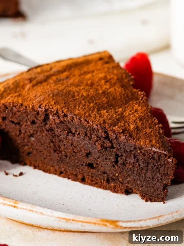 Italian Cannoli Cake Recipe: Classic Sicilian Dessert Guide 21 A slice of torta caprese on a white plate.