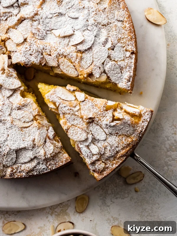 Italian Cannoli Cake Recipe: Classic Sicilian Dessert Guide 22 Italian Almond cake with a slice being removed.