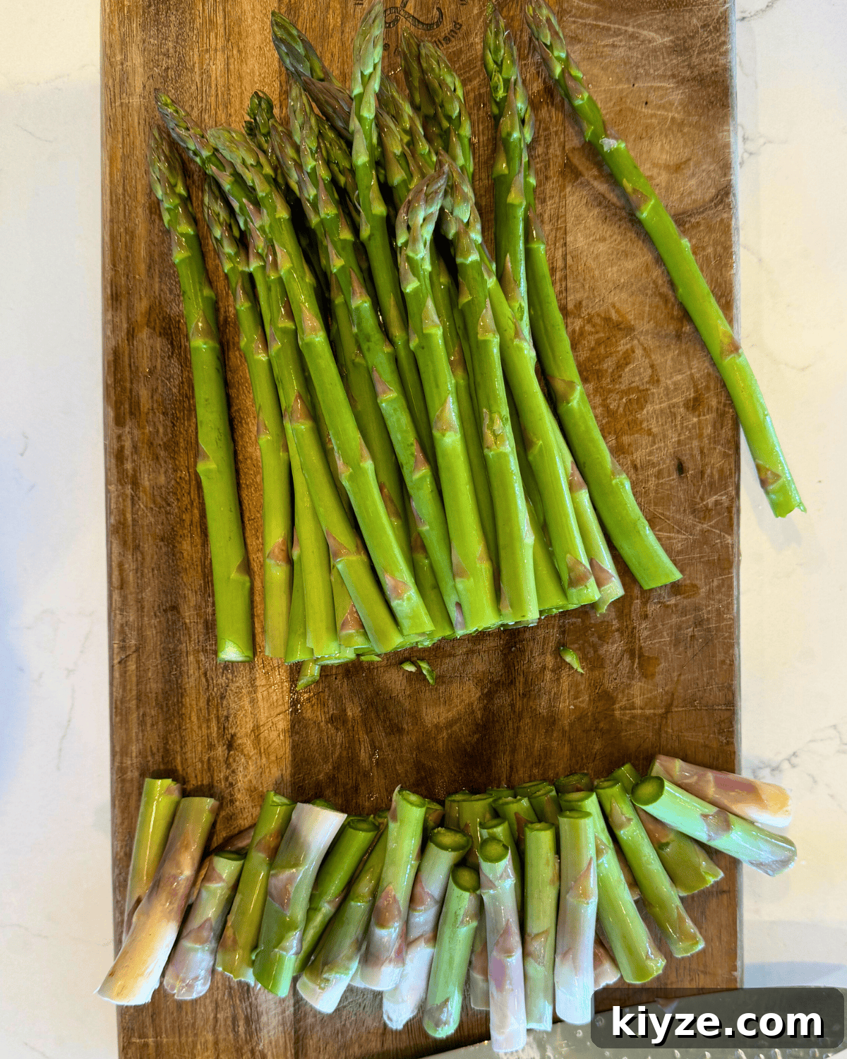 Roasted Asparagus with Crispy Parmesan Crumble 4 asparagus fresh washed and trimmed on cutting board