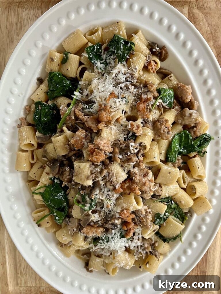 Creamy Pasta Norcina with Italian Sausage and Truffle Oil 9 Norcina Pasta on white platter.