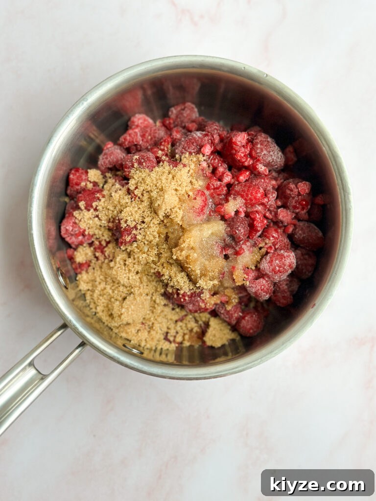 Almond Raspberry Layer Cake with Fresh Raspberry Glaze 4 raspberry compote before cooking.