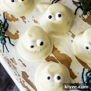 cookies dipped in white chocolate with candy eyes to look like ghosts