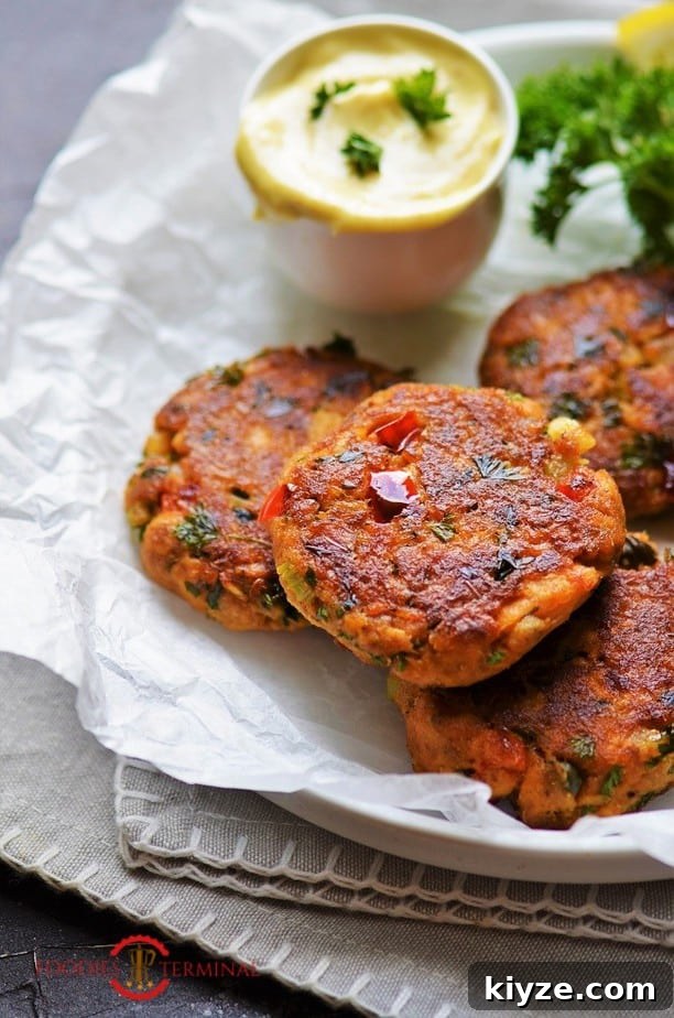 Crispy Salmon Patties Made with Flour: Simple Pan-Fried Recipe 12 Salmon Patties with flour served on a parchment paper lined plate