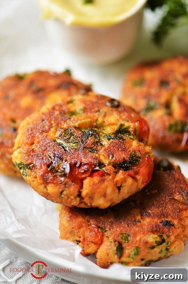 Crispy Salmon Patties Made with Flour: Simple Pan-Fried Recipe 3 Salmon Patties with canned salmon kept on top of another