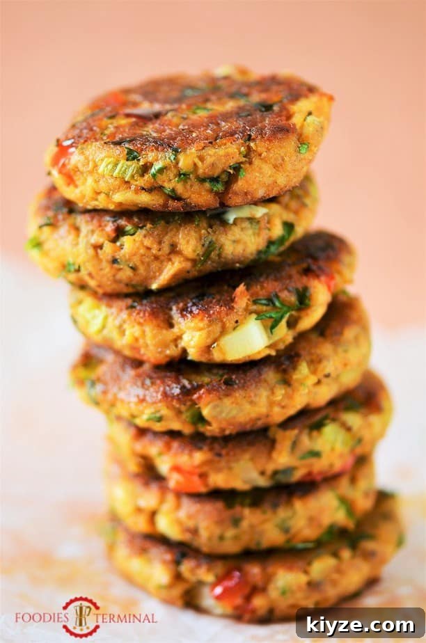 Crispy Salmon Patties Made with Flour: Simple Pan-Fried Recipe 5 Salmon patties with flour stacked high vertically