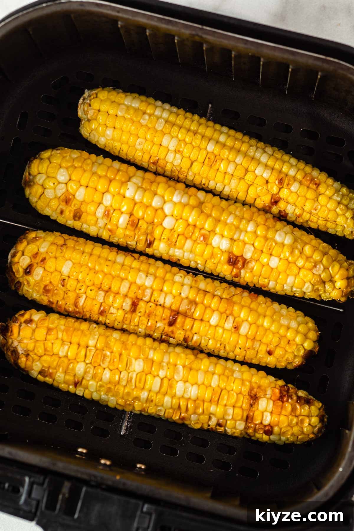 Crispy Air Fryer Corn on the Cob in 15 Minutes 7 air fried corn on the cob.