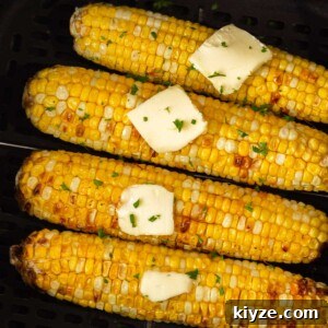 Crispy Air Fryer Corn on the Cob in 15 Minutes 10 corn on the cob with butter in the air fryer.