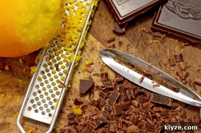 Orange Chocolate Ribbon Cookies Recipe — Zesty Cocoa Swirls 3 A cutting board with chocolate on it.