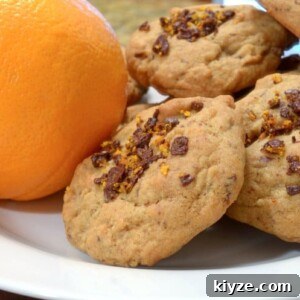 Orange Chocolate Ribbon Cookies Recipe — Zesty Cocoa Swirls 7 A stack of orange chocolate cookies.