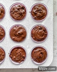 Blackberry Chocolate Cupcakes Recipe with Rich Ganache Filling 9 process of Blackberry Chocolate Cupcakes pre oven in muffin tin