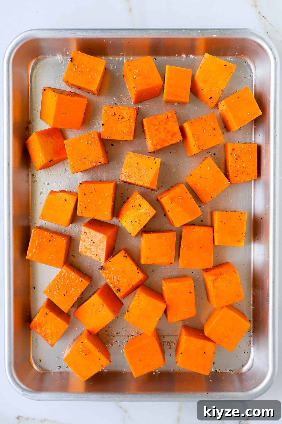 Roasted Pumpkin, Spinach and Feta Salad with Maple Vinaigrette 5 Pumpkin on a baking sheet.