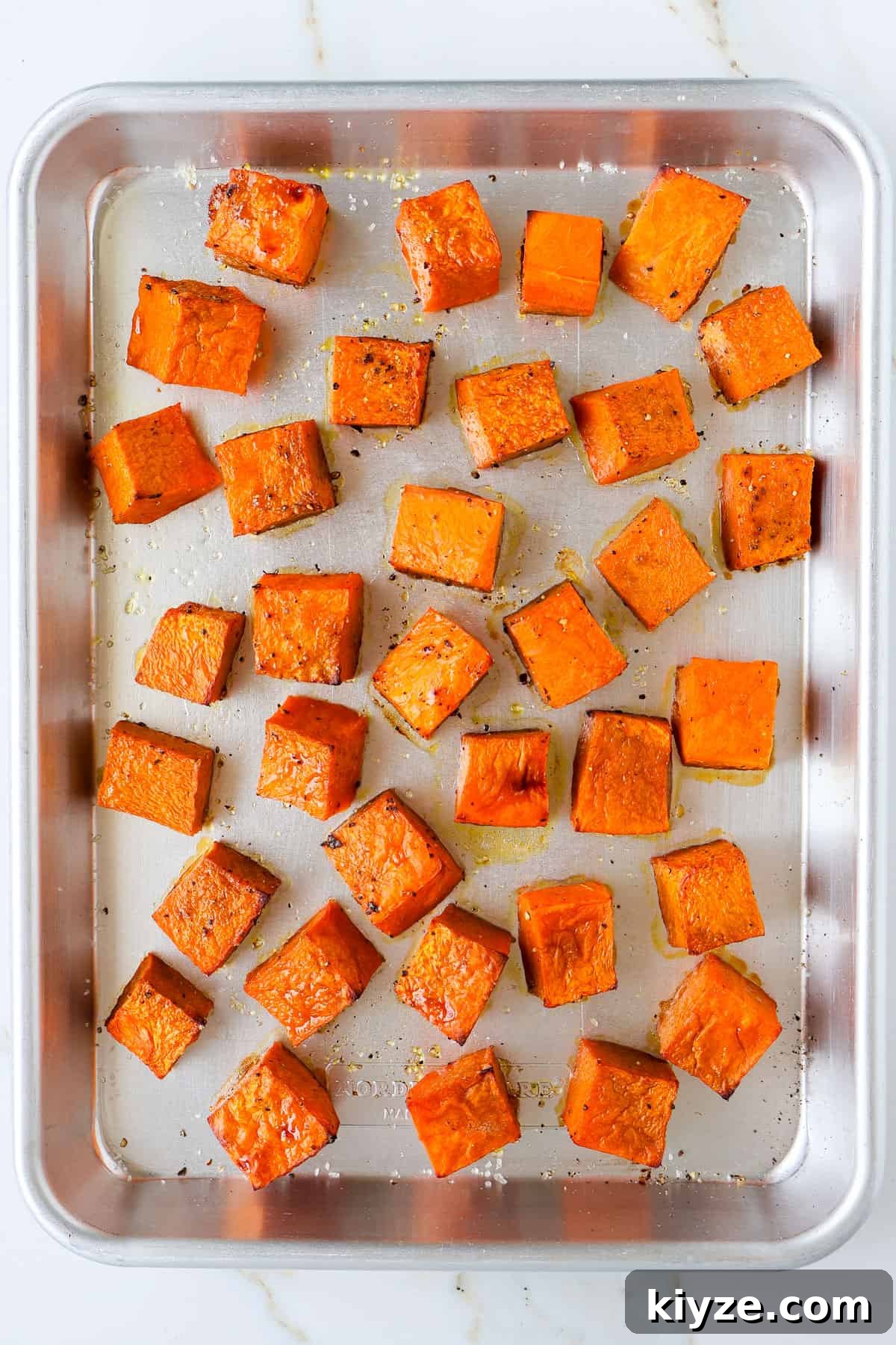 Roasted Pumpkin, Spinach and Feta Salad with Maple Vinaigrette 6 Roasted pumpkin on baking sheet.