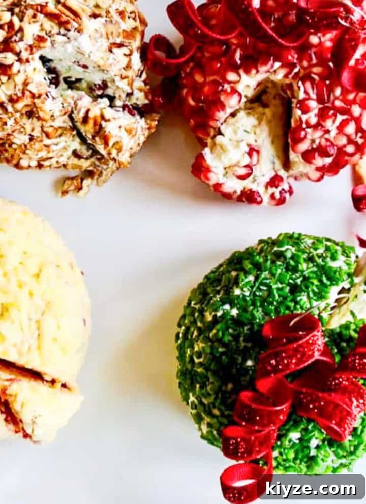 4 cheese balls shaped round and topped with curly bows and ornament hooks to serve as Christmas appetizers.