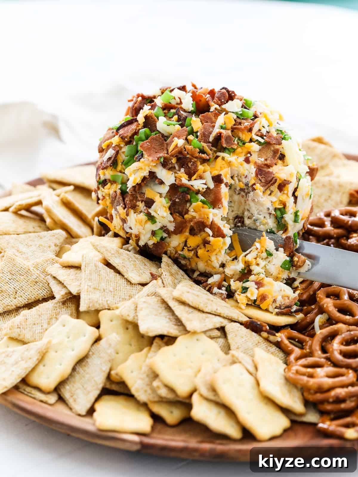 Savory Bacon Ranch Cheese Ball Recipe for Parties 8 Cheese Ball on round wood platter