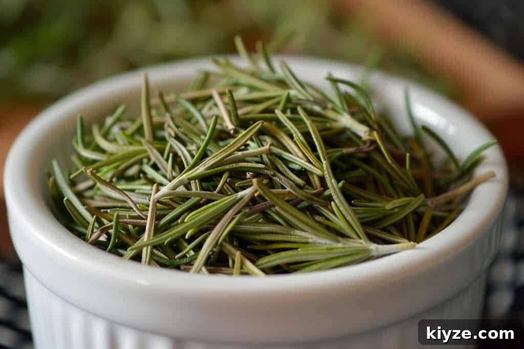 Fresh Rosemary Guide: How to Prep, Cook, and Store Herb Successfully 5 A white bowl filled with fresh rosemary sprigs.
