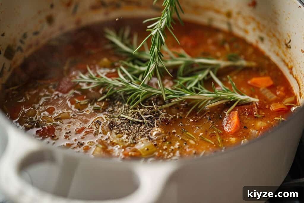 Fresh Rosemary Guide: How to Prep, Cook, and Store Herb Successfully 10 A pot of simmering soup with vegetables, herbs, and spices.
