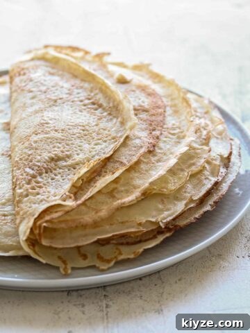 A stack of sourdough crepes, folded in half.