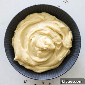 Earl Grey Custard Recipe: Silky Tea-Infused Pastry Cream 16 Earl Grey custard in a black bowl.