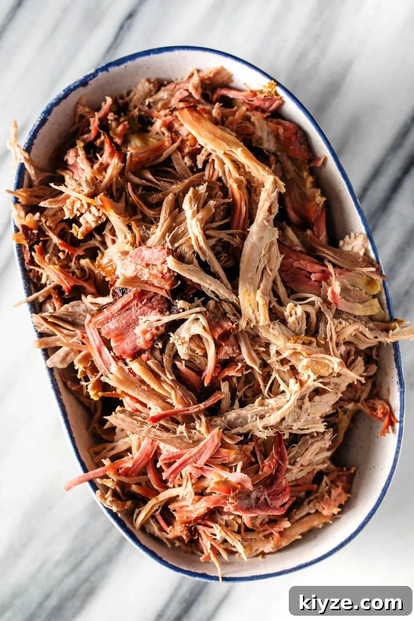 How Long to Cook a 10‑Pound Pork Shoulder: Roast, Braise, or Smoke 7 pulled smoked pork shoulder in a serving dish