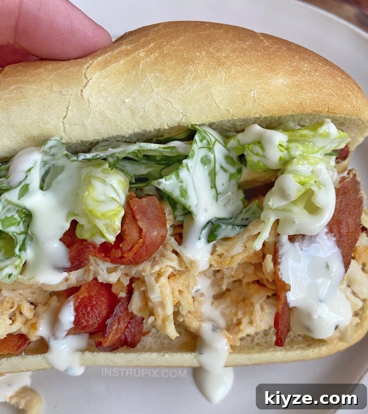 Slow-Cooker Crack Chicken Sandwich Recipe That Melts in Your Mouth 2 Easy Crockpot Crack Chicken Sandwiches (the best slow cooker shredded chicken made with cream cheese, cheddar and ranch seasoning!)
