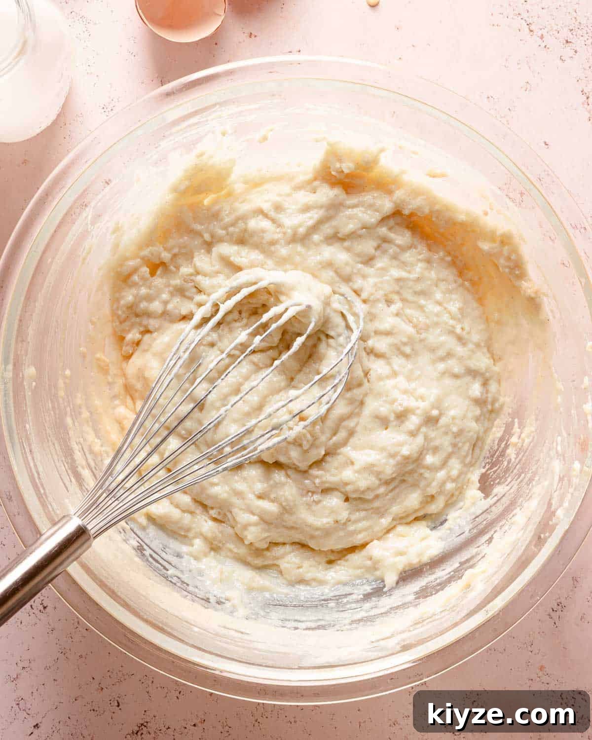 Fluffy Buttermilk Muffins Recipe for Tender Homemade Muffins 9 muffin batter in bowl with whisk.