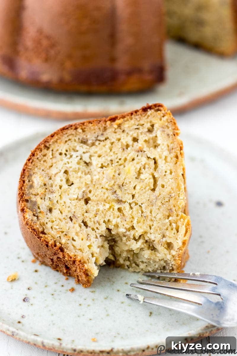 Moist Plantain Cake Recipe with Coconut Frosting 5 Plantain cake slice with fork on the side