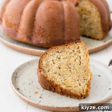 Moist Plantain Cake Recipe with Coconut Frosting 7 Slice of plantain cake on speckled plate
