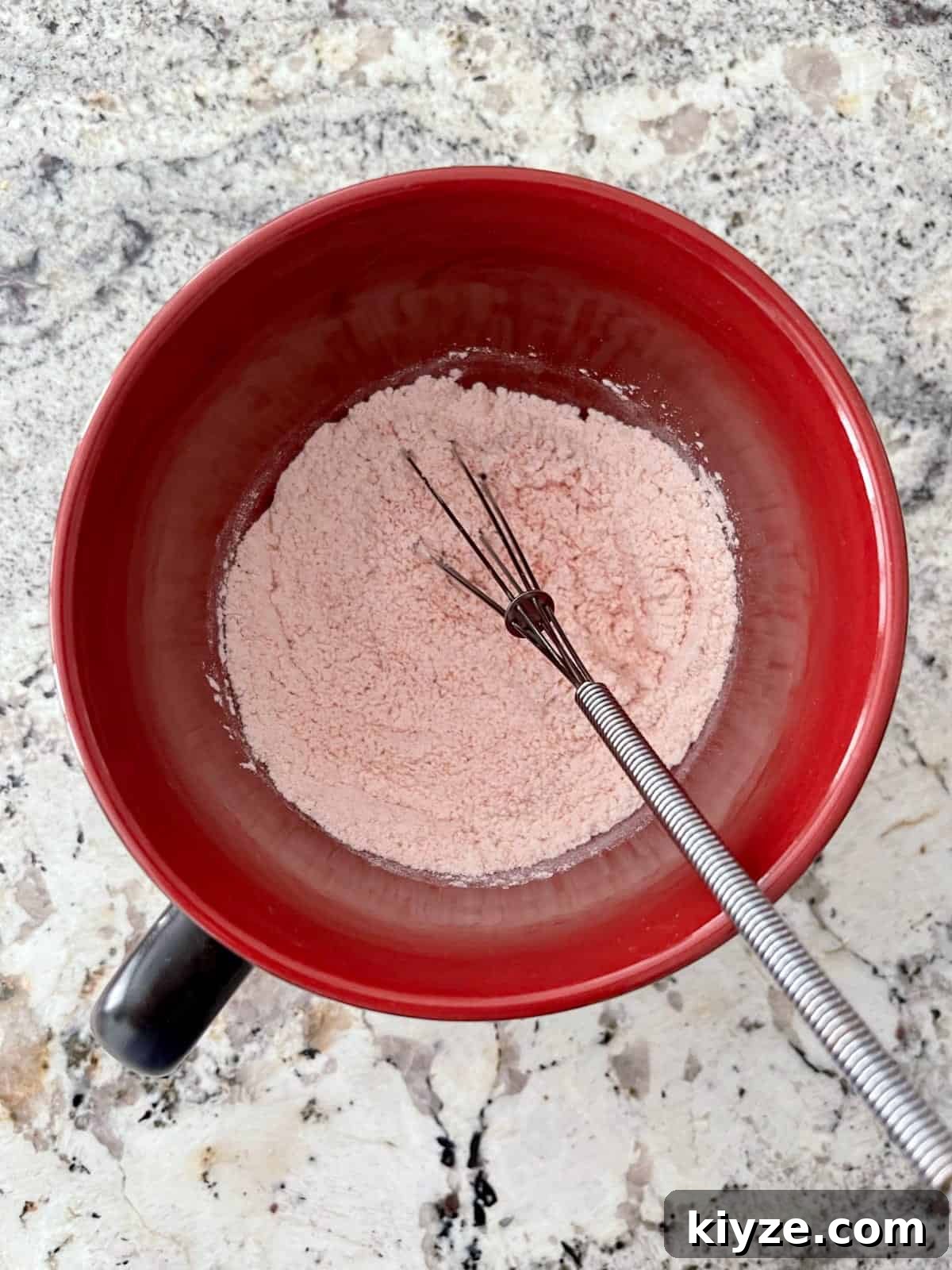 Microwave Mug Jello Cake Recipe: Quick Single-Serve Dessert 4 Whisking flour, baking powder, sweetener and raspberry Jell-o powder in large mug.