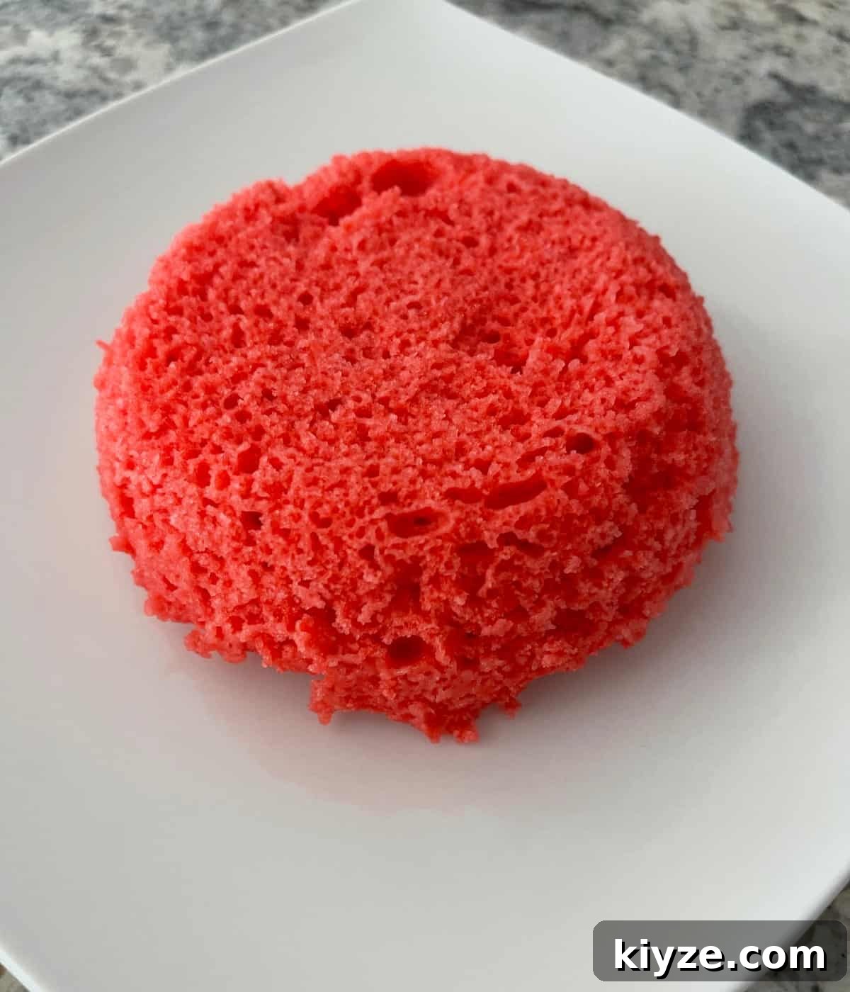 Microwave Mug Jello Cake Recipe: Quick Single-Serve Dessert 7 Plain Raspberry Jell-o Microwave Mug Cake on white plate.