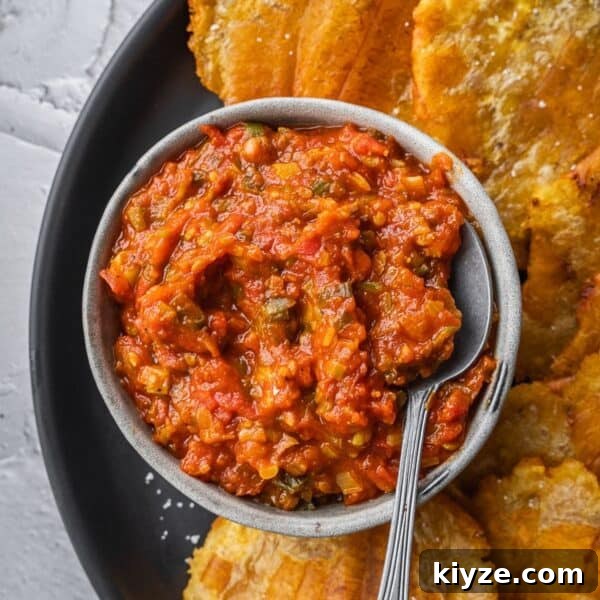 Hogao: Authentic Colombian Tomato and Scallion Creole Sauce Recipe 12 Colombian hogao sauce in a bowl surrounded by fried plantains.