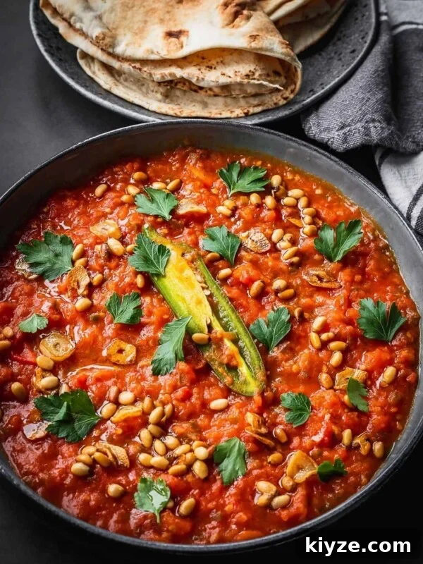 Hogao: Authentic Colombian Tomato and Scallion Creole Sauce Recipe 9 A plate with levantine fried tomatoes garnished with parsley.
